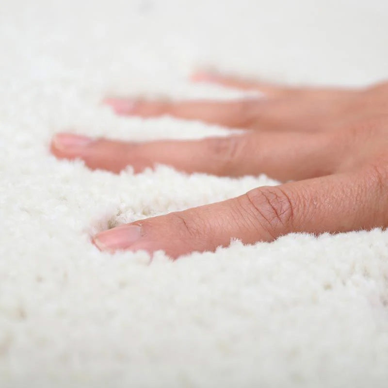Alfombra de tacto de lana blanca infantil