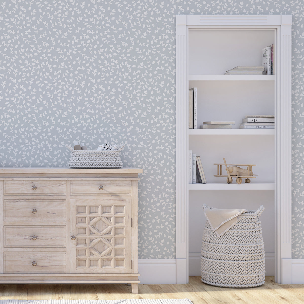 Decoración de habitación de niños con papel pintado azul y blanco de ramitas